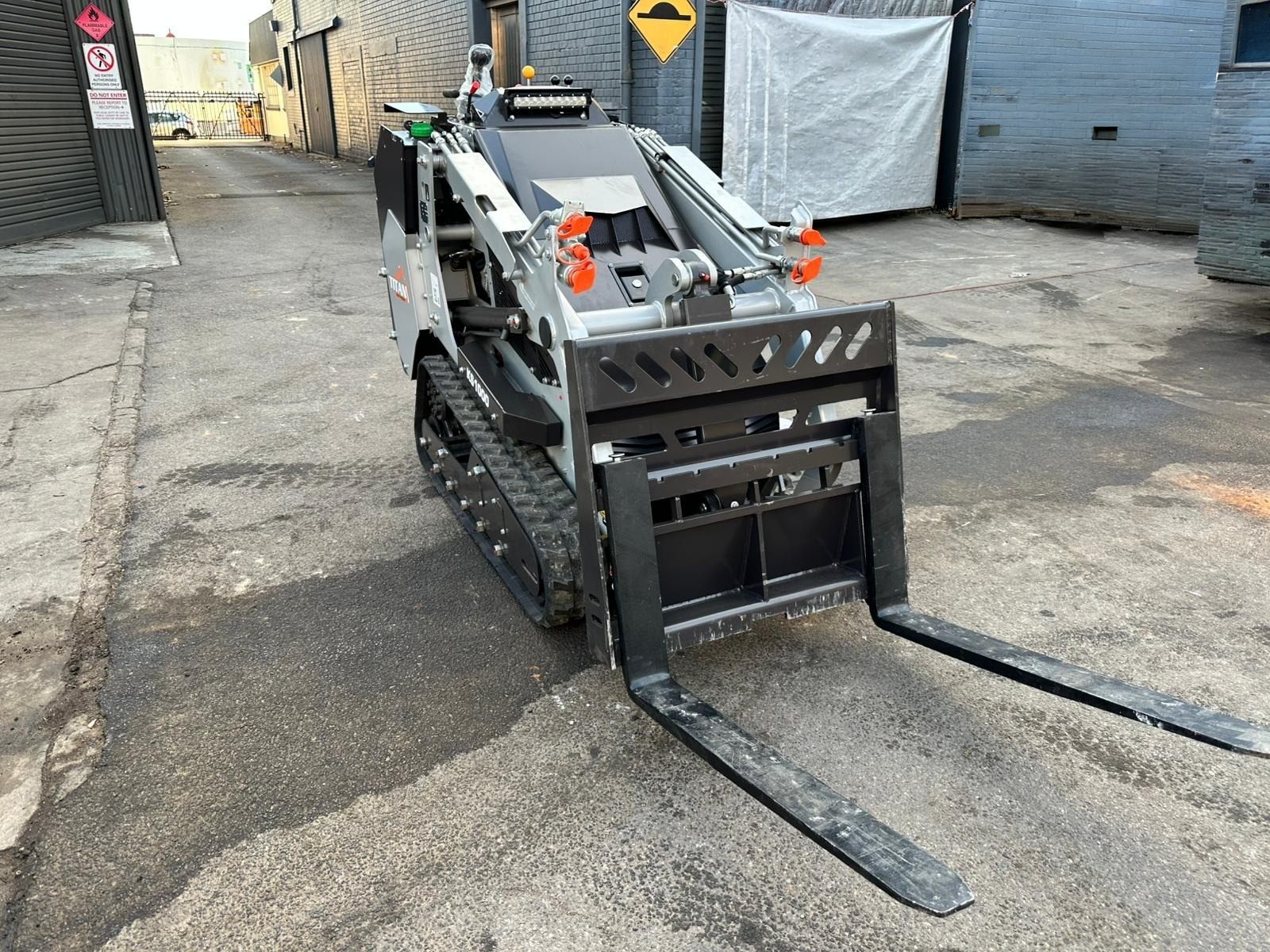 Titan KS1000 mini skid steer loader with pallet forks