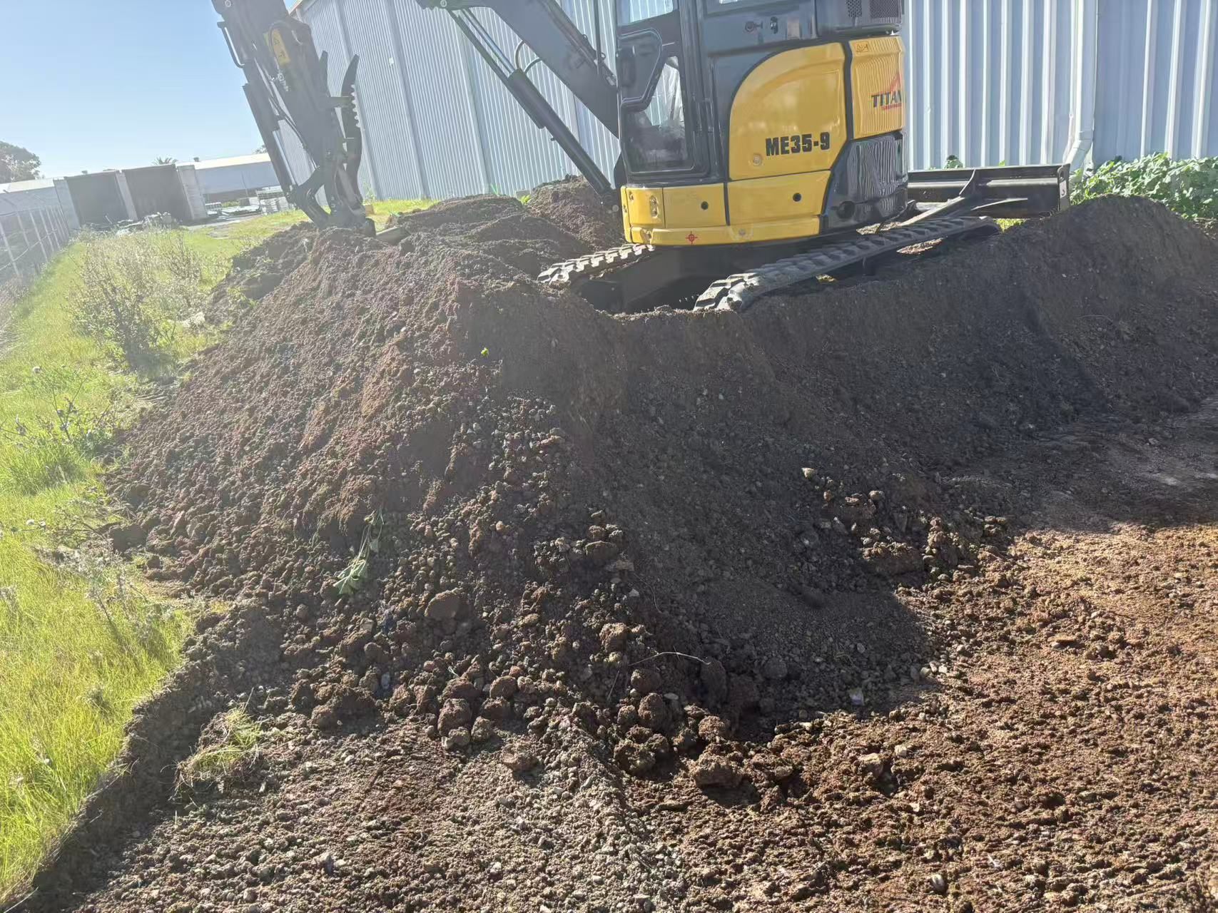 Titan ME35.9 compact excavator working on site